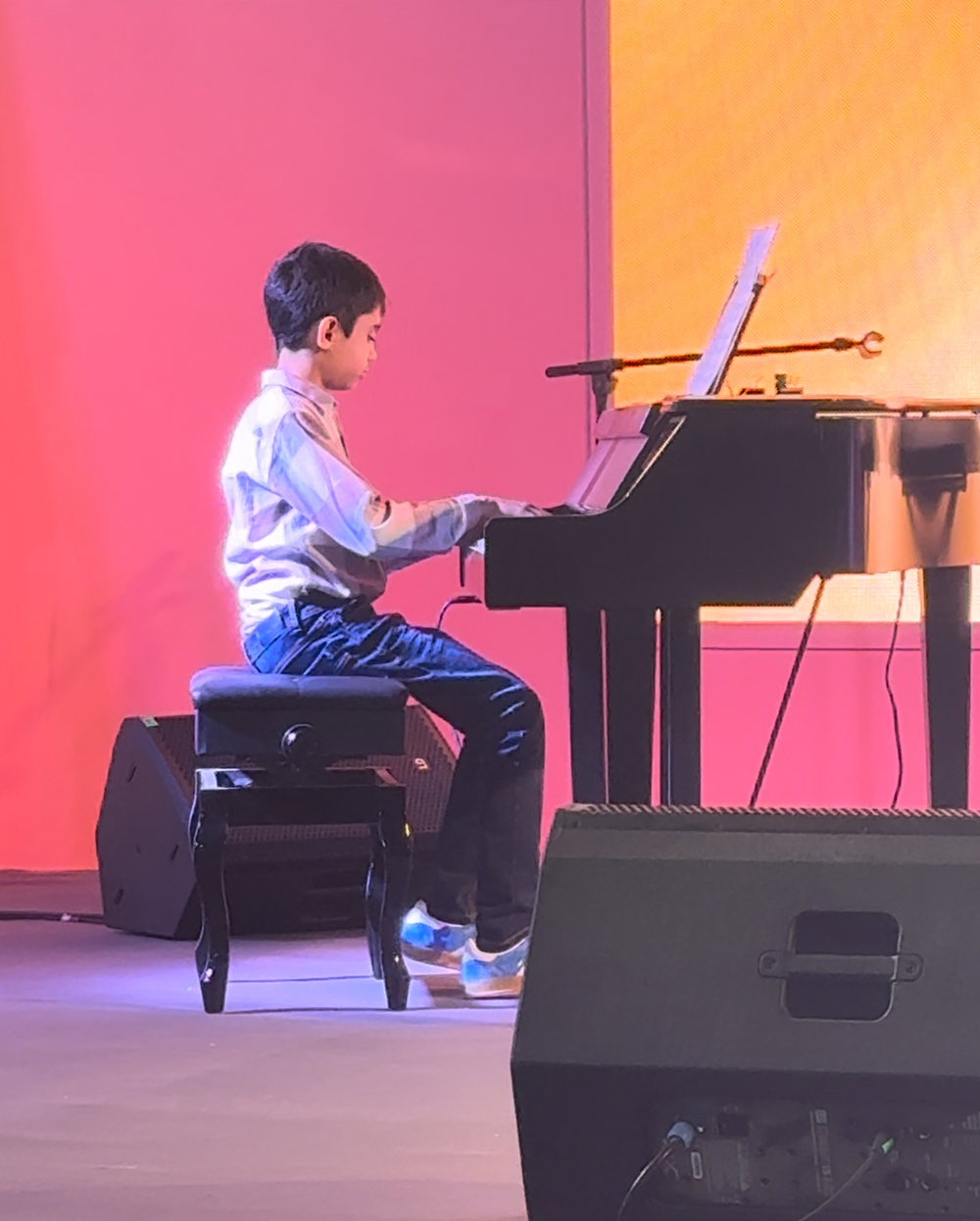 Viaan Ghorpade performing piano at a concert in Dubai