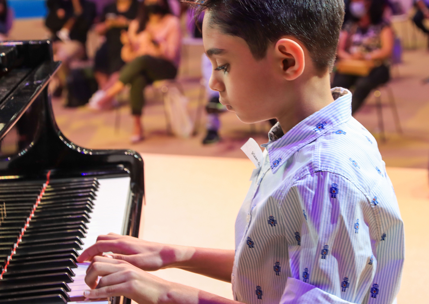 Viaan Ghorpade performing piano at a concert in Dubai