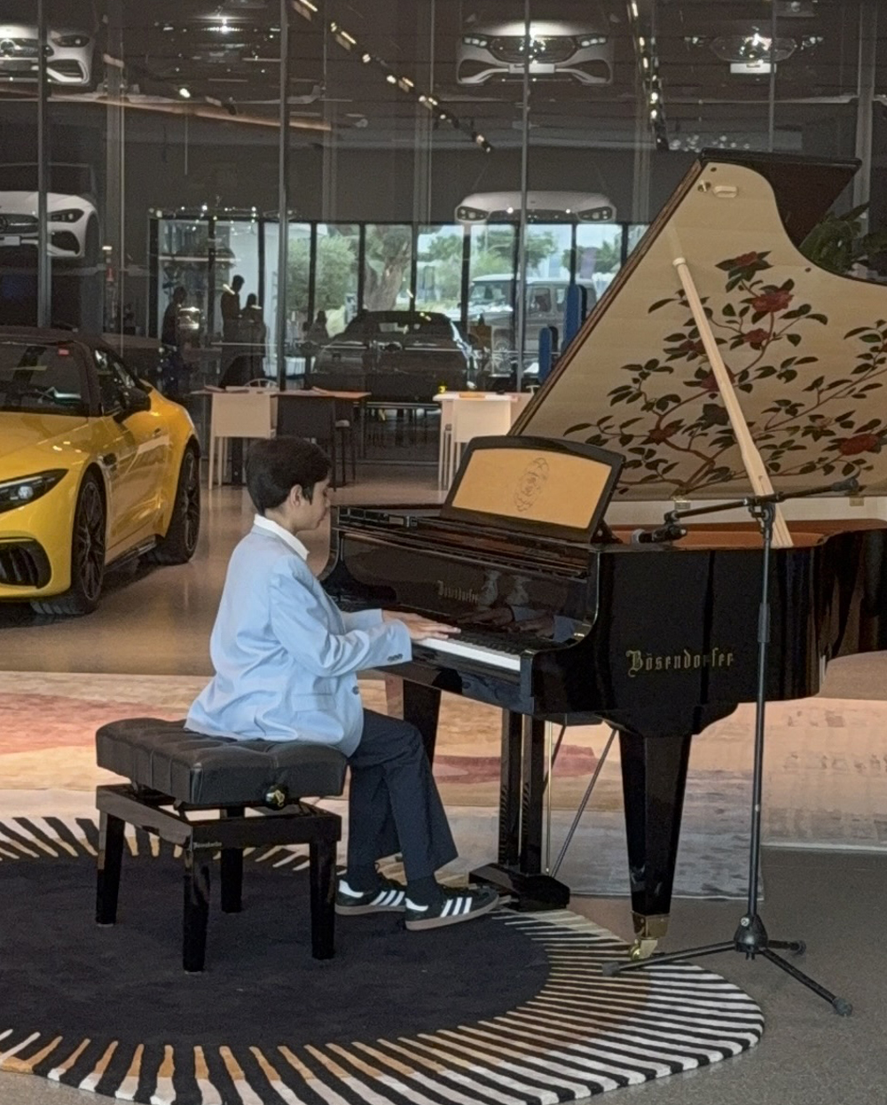 Viaan Ghorpade performing piano at Mercedes Benz Centre in Dubai