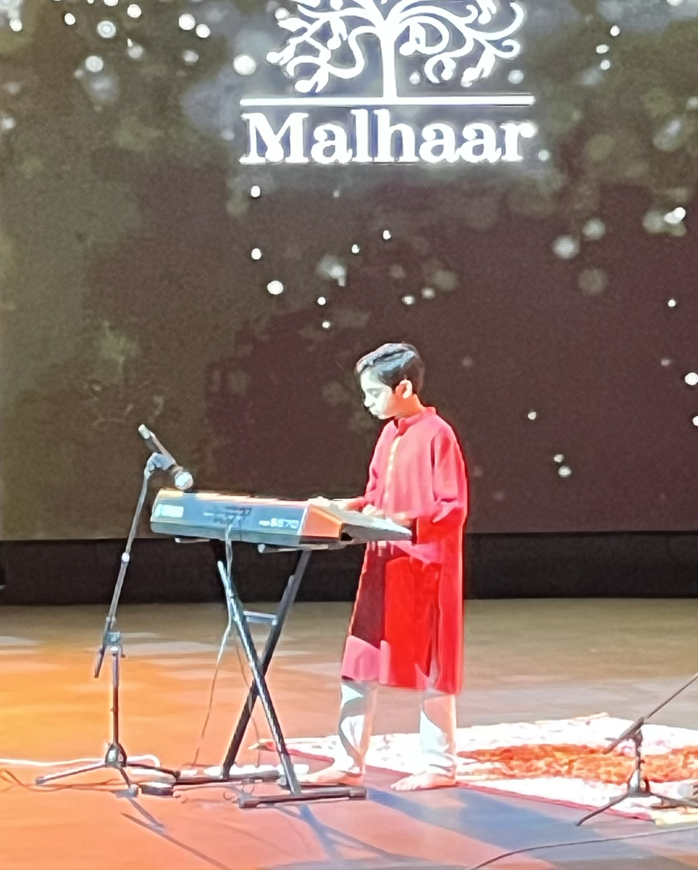 Viaan Ghorpade performing Indian classical rendition of Raag Yaman on keyboard at a concert in Dubai