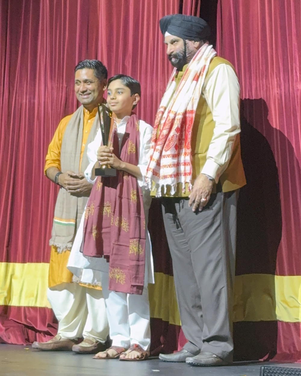 Viaan Ghorpade receiving runners up trophy at Sur Taal Sangam competition in Dubai